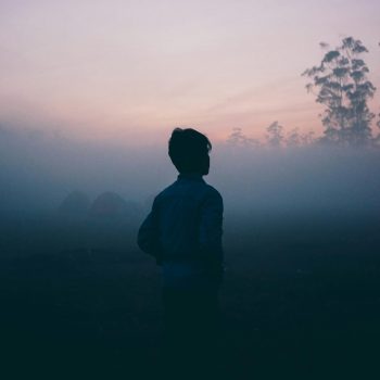 Person in shadow looking at view (grief) Person in shadow looking at view (grief)