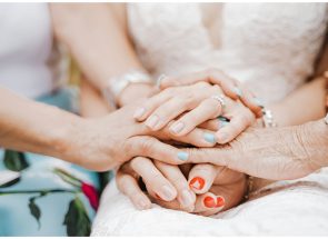 person with orange nail polish